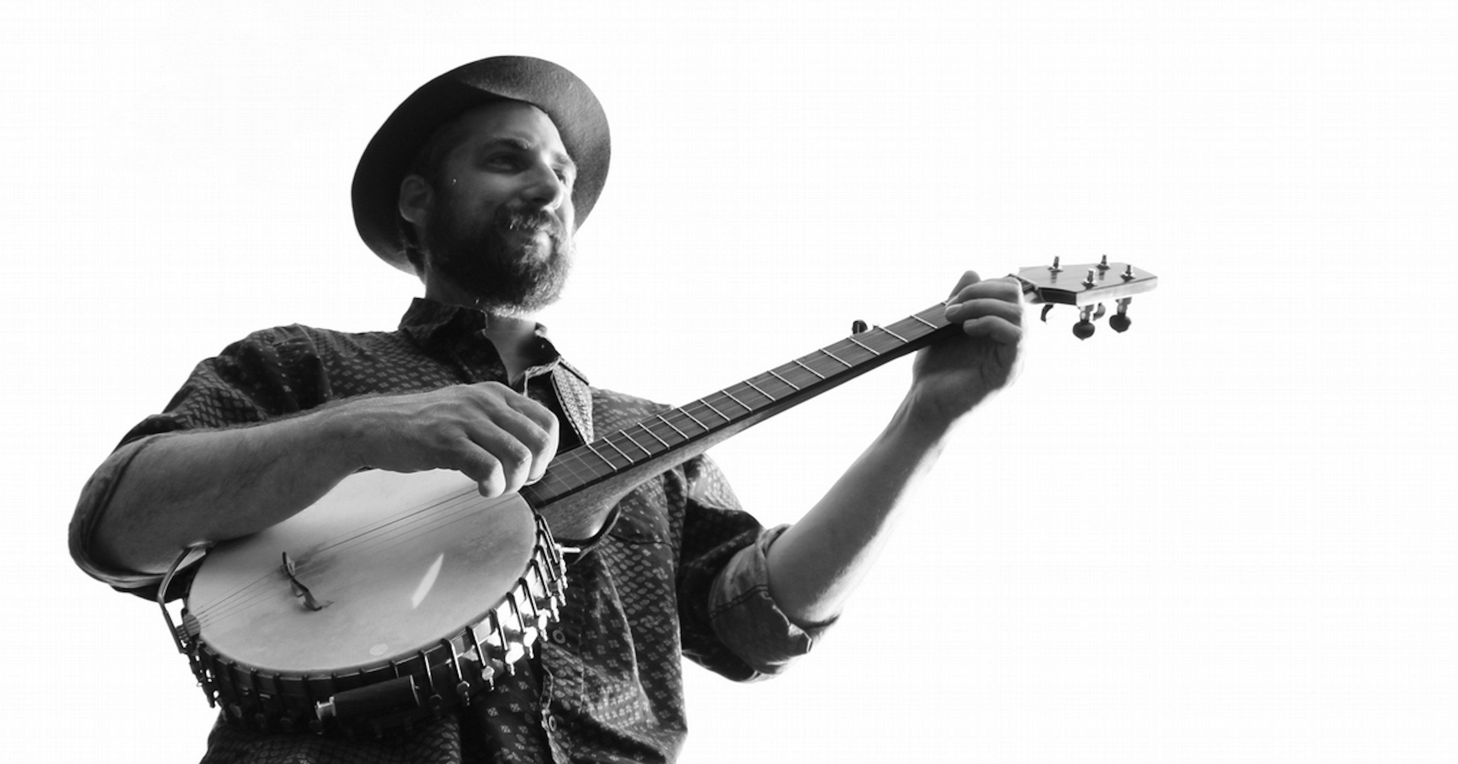 Ben playing banjo, black and white