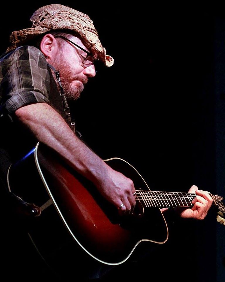 Davey O performing with a guitar
