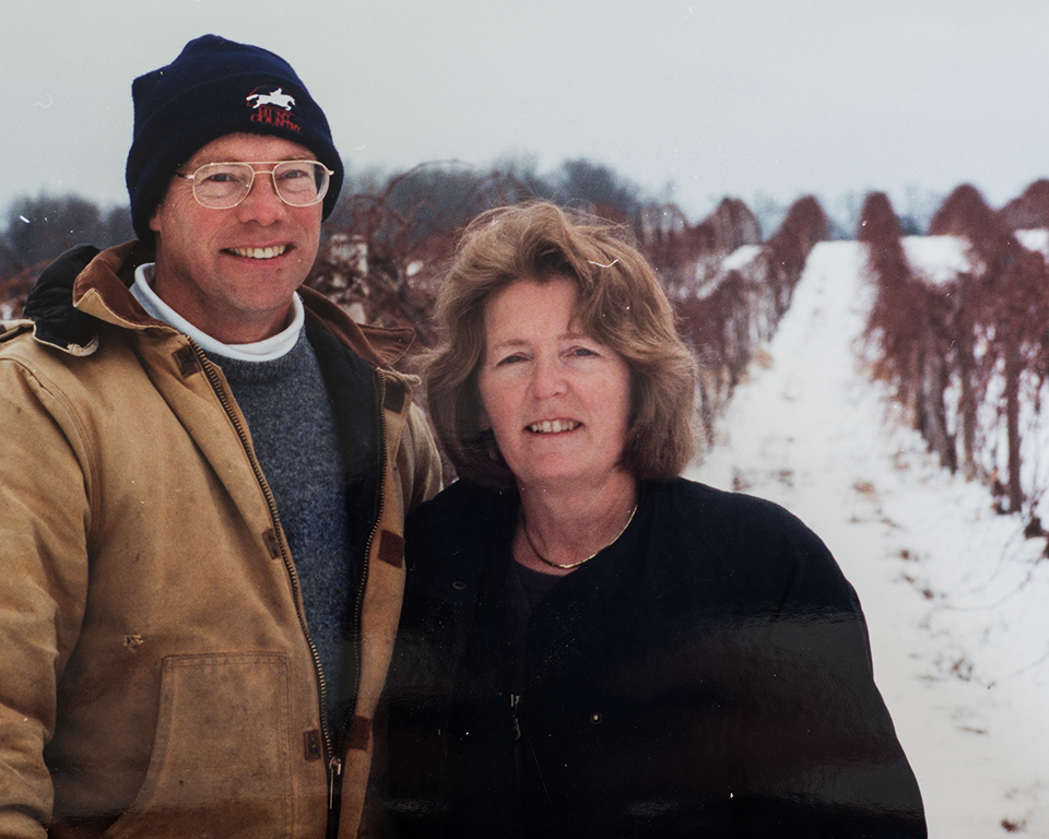 Old photo of Art and Joyse posing in vineyards.