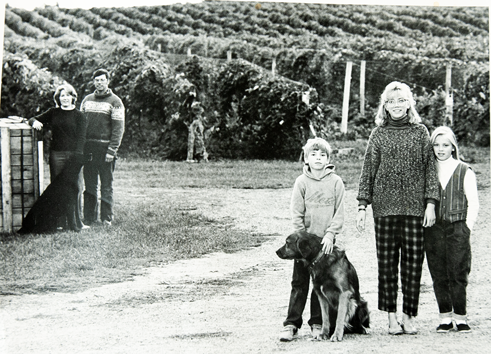 Old black and white photo ofwhole family in vienyards.