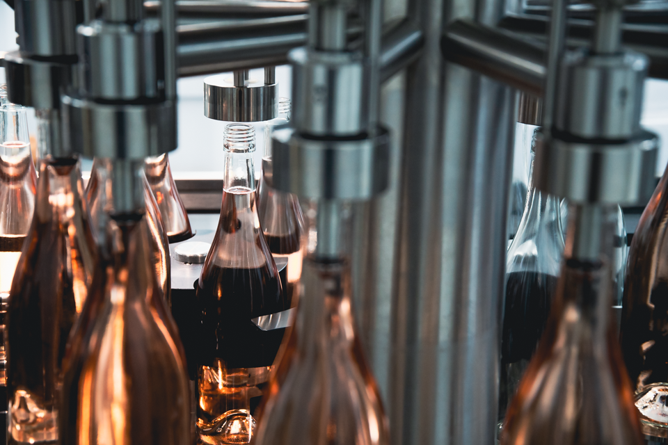 Image of bottles being filled with rosé.