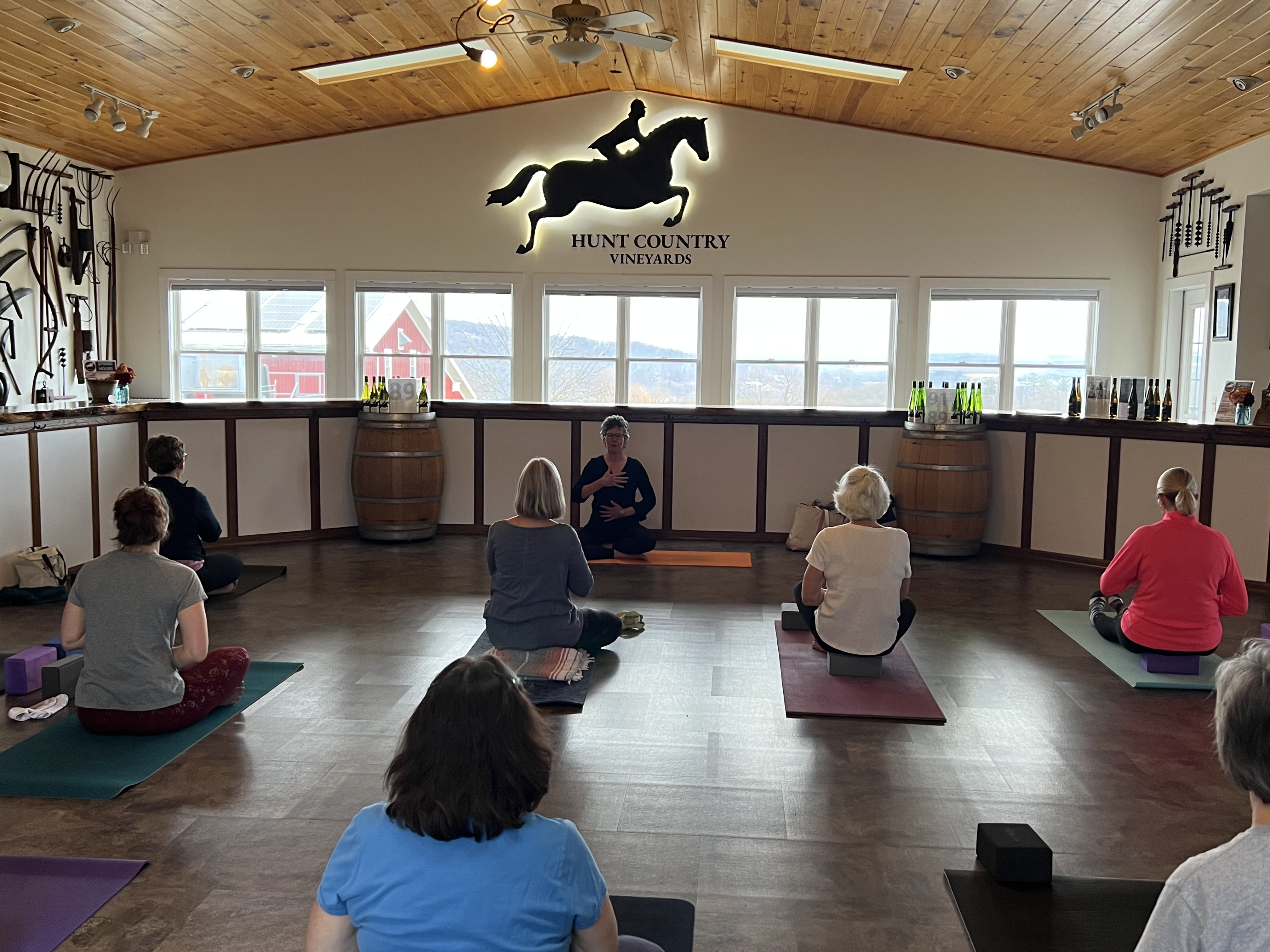 Jan Corning leading yoga class in  the Hunt Country Tasting Room